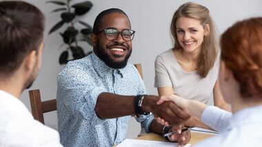 co-workers shaking hands